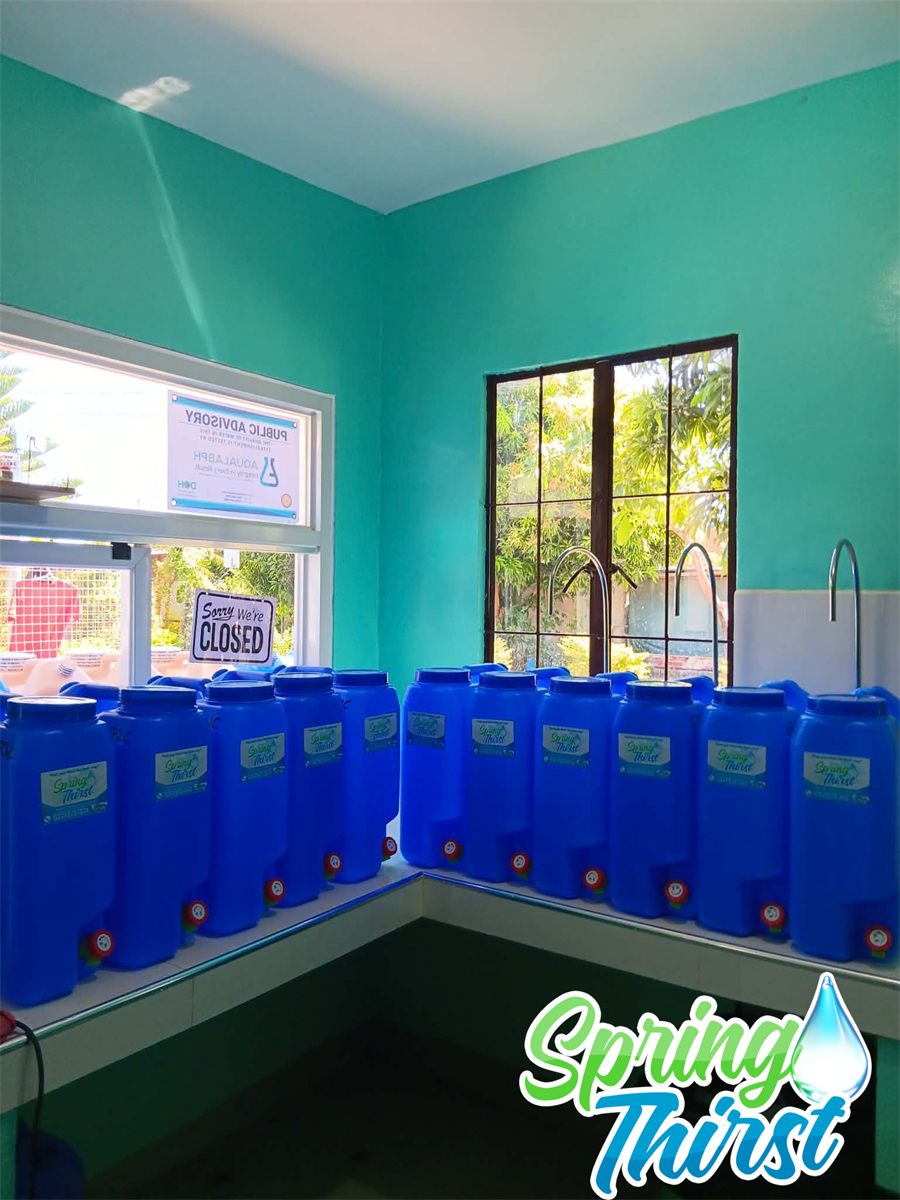 Rows of clean refilled water containers ready for customers